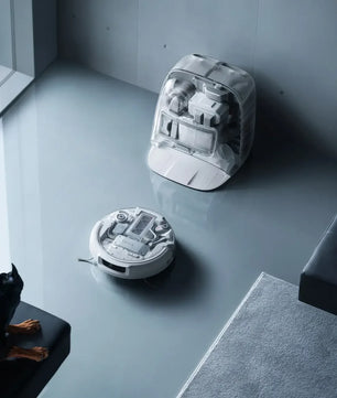 DJI ROMO P Robot Vacuum Cleaner with Transparent Self-Cleaning Base Station, featuring minimalist aesthetic design, drone-powered obstacle sensing, and high-pressure cleaning for home floor care