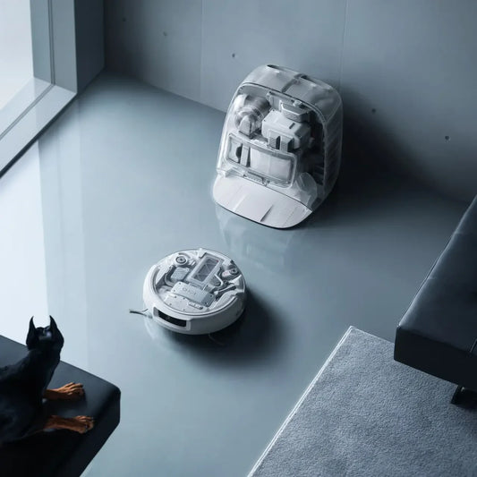 DJI ROMO P Robot Vacuum Cleaner with Transparent Self-Cleaning Base Station, featuring minimalist aesthetic design, drone-powered obstacle sensing, and high-pressure cleaning for home floor care